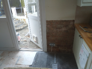 Damp damaged plaster before treatment Purley