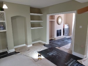 Raynes Park rising damp damage at low level on internal wall