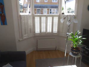 Damp affected wall before treatment in Sutton London