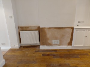 Plaster restoration after rising damp treatment in Carshalton