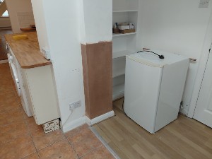 Replastered wall following DPC treatment in Carshalton SM5