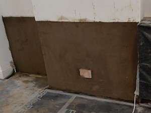 Specialist 2nd damp-resistant render coat applied in Carshalton property